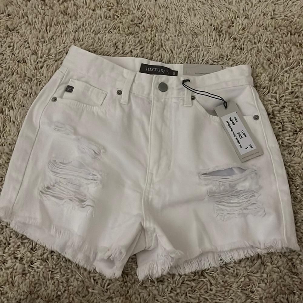 White ripped jean shorts